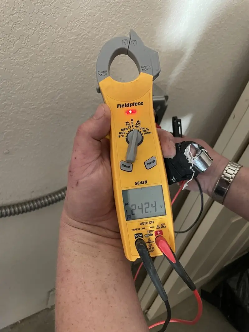 Voltage testing with clamp meter during Generator Installation in Layton